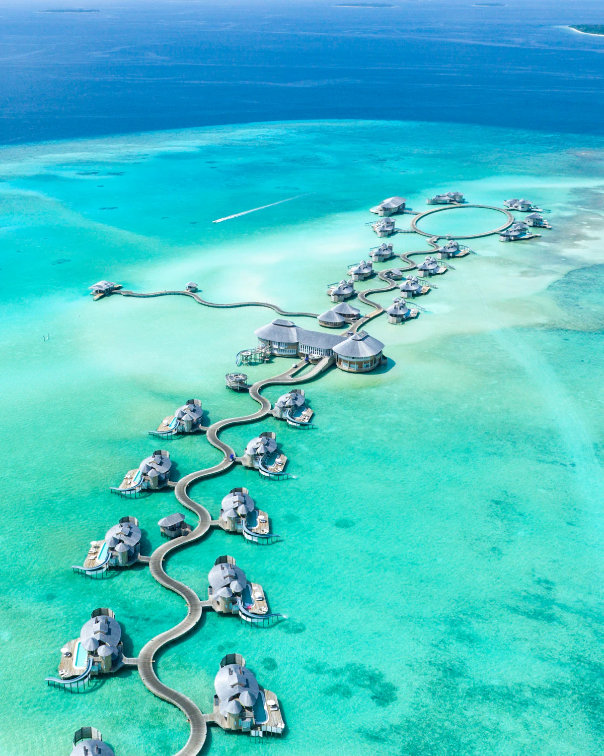 Maldives overwater luxury villas and clear turquoise lagoons